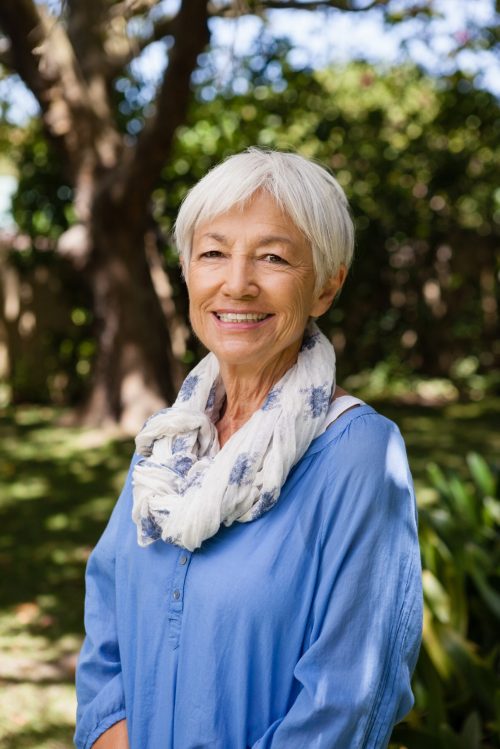 portrait-of-smiling-senior-woman-standing-in-backy-2026-01-11-10-31-23-utc
